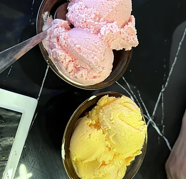 Scoops of strawberry and mango ice cream